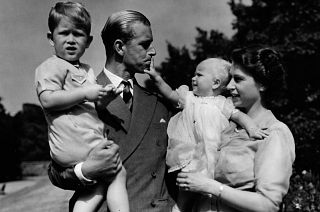 In this August 1951 photo, Princess Elizabeth stands with her husband Prince Philip, the Duke of Edinburgh, and their children Prince Charles and Princess Anne