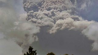 Plumes of ash rise from the La Soufriere volcano as it erupts on the eastern Caribbean island of St. Vincent, as seen from Chateaubelair, April 9, 2021.