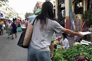woman delivers the Molotov newsletter to people in a market
