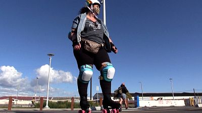 Woman on roller skates and in skating gear