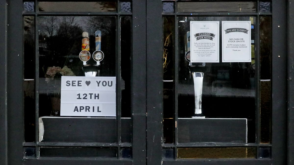 The window of The Rutland Arms pub shows their opening date in Hammersmith, London, Wednesday, April 7, 2021.