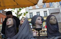 Mannequins present Muslim veils at an open air market in Lille.