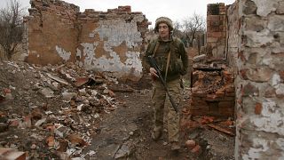 A Ukrainian serviceman patrols near the frontline in the fight against Russian-backed separatists near the small city of Marinka, Donetsk region