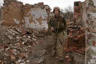 A Ukrainian serviceman patrols near the frontline in the fight against Russian-backed separatists near the small city of Marinka, Donetsk region