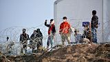 Residents of the temporary camp at Tara Kepe on the Aegean island of Lesbos