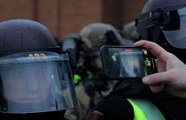 Protestor films state patrol personnel’s faces up close with cell phone
