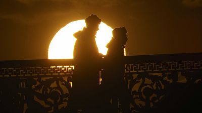 Russian soldiers silhouetted by the setting sun in downtown St. Petersburg, Russia, Friday, March 20, 2020. ((AP Photo/Dmitri Lovetsky)