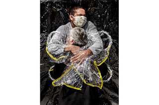 Rosa Luzia Lunardi (85) is embraced by nurse Adriana Silva da Costa Souza, at Viva Bem care home, São Paulo, Brazil. August 5, 2020