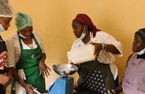 Fatoumata is weighing flour at a baking class in Conakry, Guinea.