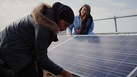 Locals buiding their solar power grid in Brixton, UK