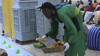 Senegalese worshippers distribute free meals during Ramadan