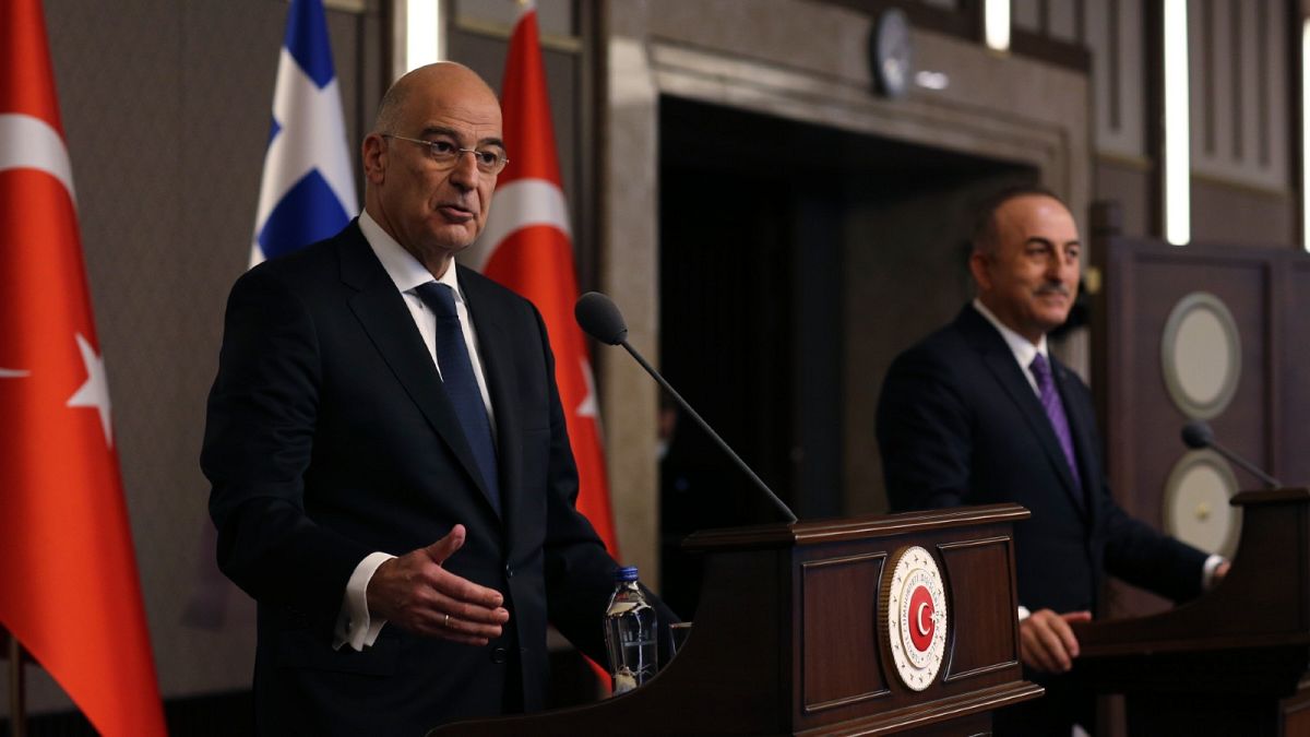 Greece's foreign minister Nikos Dendias, left, and his Turkish counterpart Mevlut Cavusoglu.