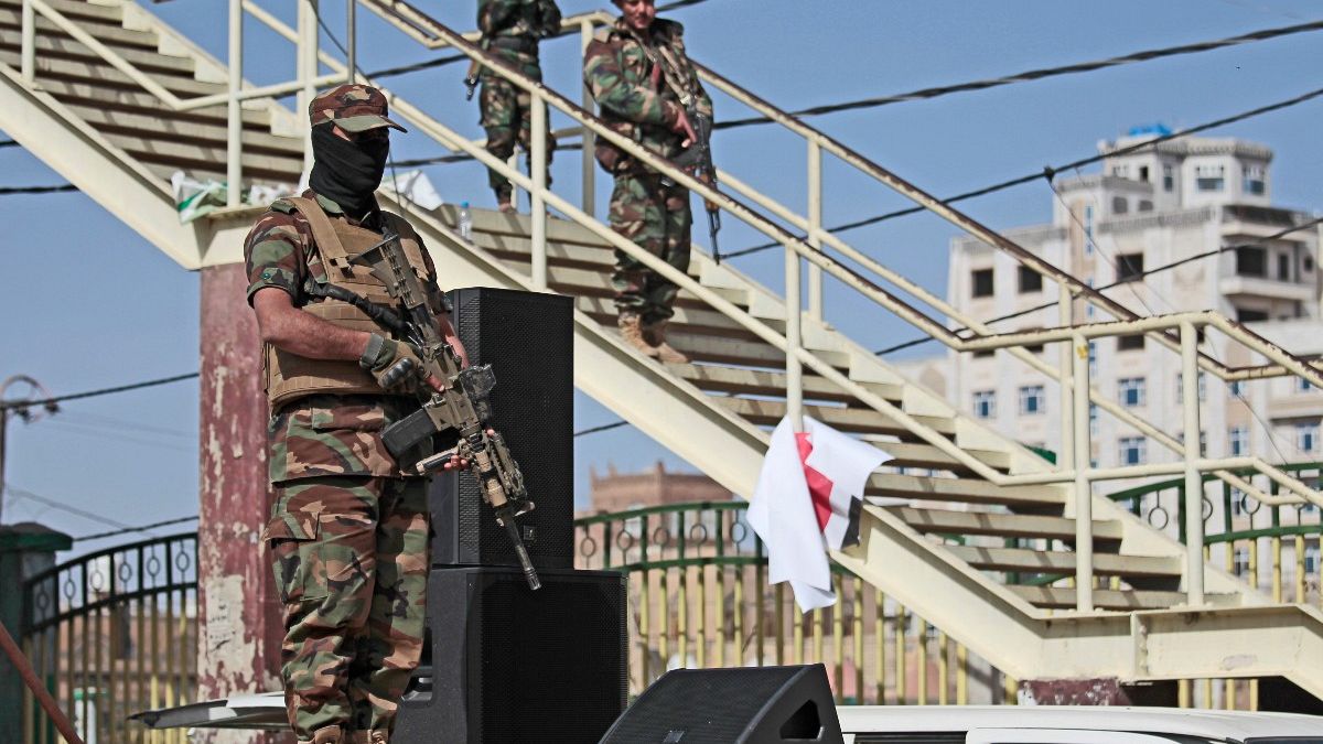 Houthi fighters stand guard during a rally marking six years for a Saudi-led coalition in Sanaa, Yemen