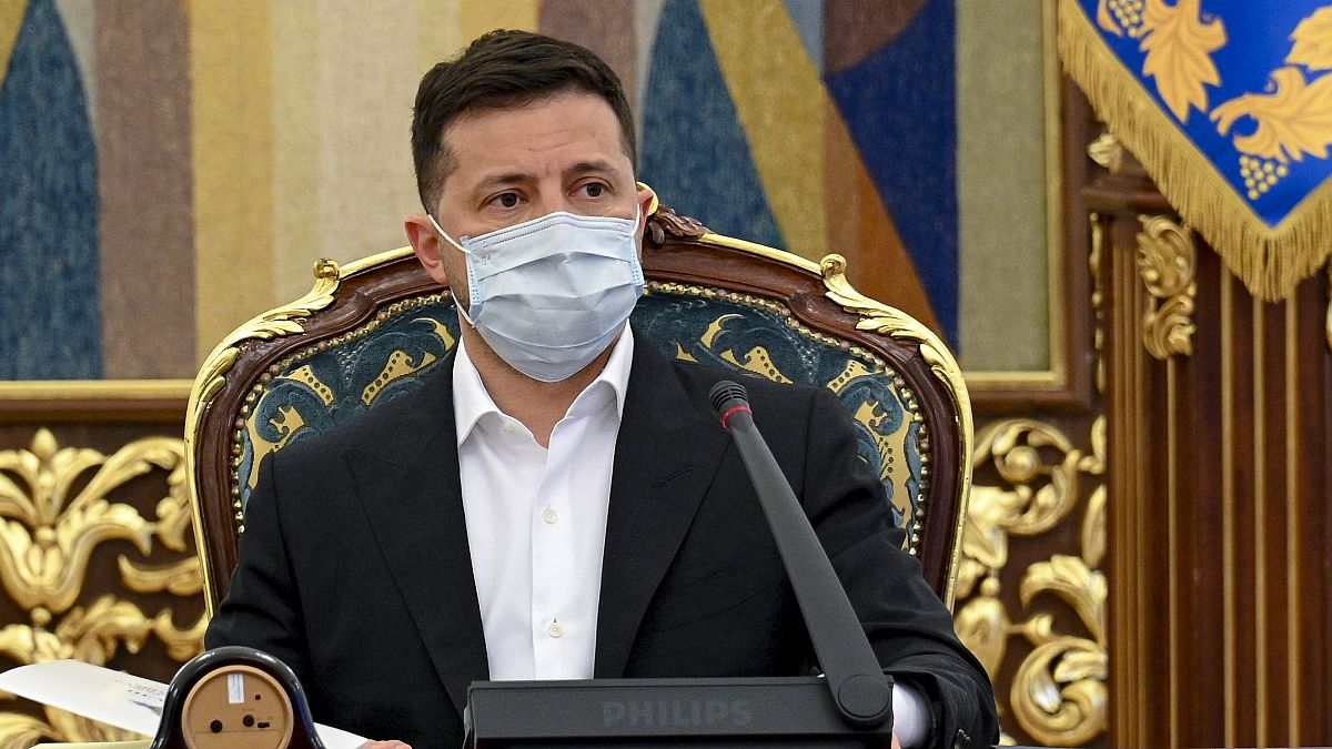 In this photo released by Ukrainian Presidential Press Office, Ukrainian President Volodymyr Zelenskyy leads a meeting of the National Security and Defense Council in Kyiv.