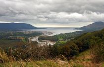 Warrenpoint village in the UK, whose ferry connects Northern Ireland, left, with the Republic of Ireland, right.