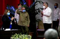 Raul Castro, first secretary of the Communist Party and former president, waves to members at the Congress of the Communist Party of Cuba's opening session, April 16, 2021