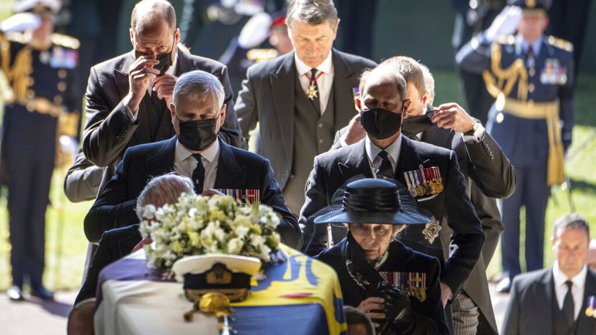 Pallbearers carry the coffin of Prince Philip, Duke of Edinburgh into St. George's Chapel at Windsor Castle, followed by members of his family