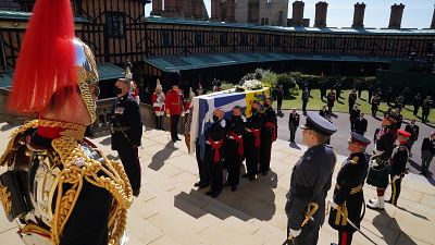 The coffin is held on the steps of St George's Chapel during the procession of Britain Prince Philip's funeral at Windsor Castle