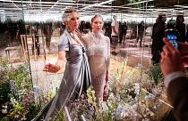 model Kate Moss, left, and her daughter Lila Grace Moss wear a creation for Fendi's Spring-Summer 2021 Haute Couture fashion collection presented in Paris on Jan. 27, 2021.