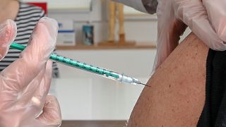 A patient receives the AstraZeneca vaccine in Germany