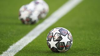 The Official UEFA Champions League match balls are on display ahead of the Champions League quarter final second leg soccer match between Liverpool and Real Madrid at Anfield