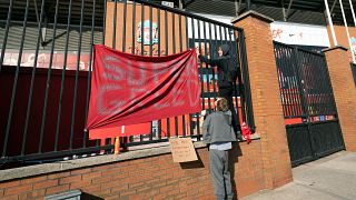 Fans protest against the formation of the Super League outside Liverpool's ground
