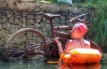 Lifting a bike out of the water