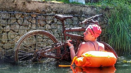 Lifting a bike out of the water