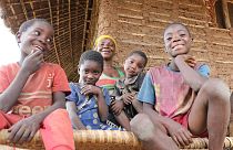 Filomena (central) with her children Felicio, Admira, Ergilia and Baptista outside their home in Cabo Delgado, Mozambique.