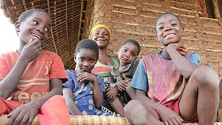 Filomena (central) with her children Felicio, Admira, Ergilia and Baptista outside their home in Cabo Delgado, Mozambique.