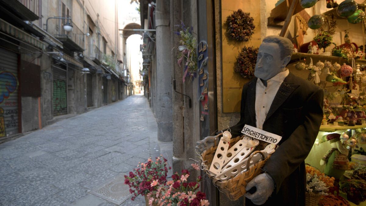 Via San Gregorio Armeno, famous for its statuettes, is empty, in downtown Naples, southern Italy, Wednesday, March 11, 2020. 