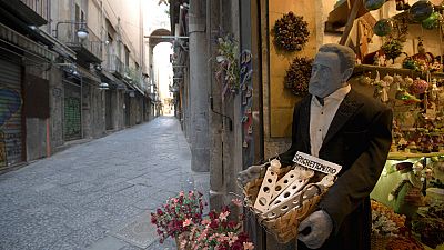 Via San Gregorio Armeno, famous for its statuettes, is empty, in downtown Naples, southern Italy, Wednesday, March 11, 2020. 