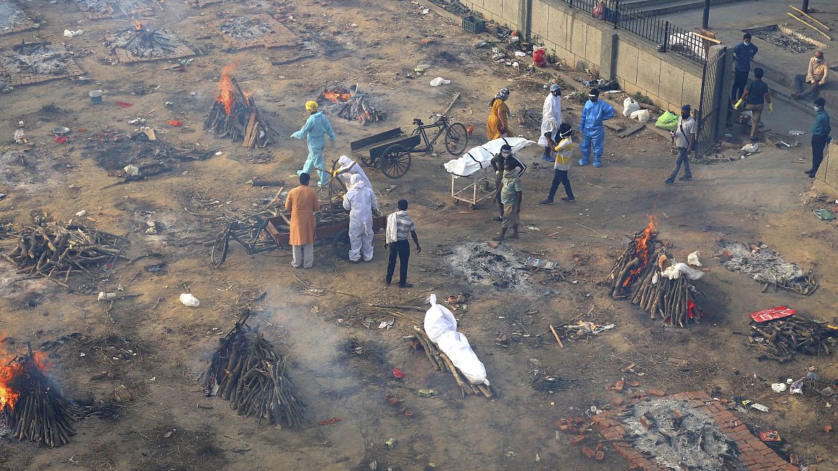 Grounds have been turned into mass cremation sites as as India's COVID death toll skyrockets 