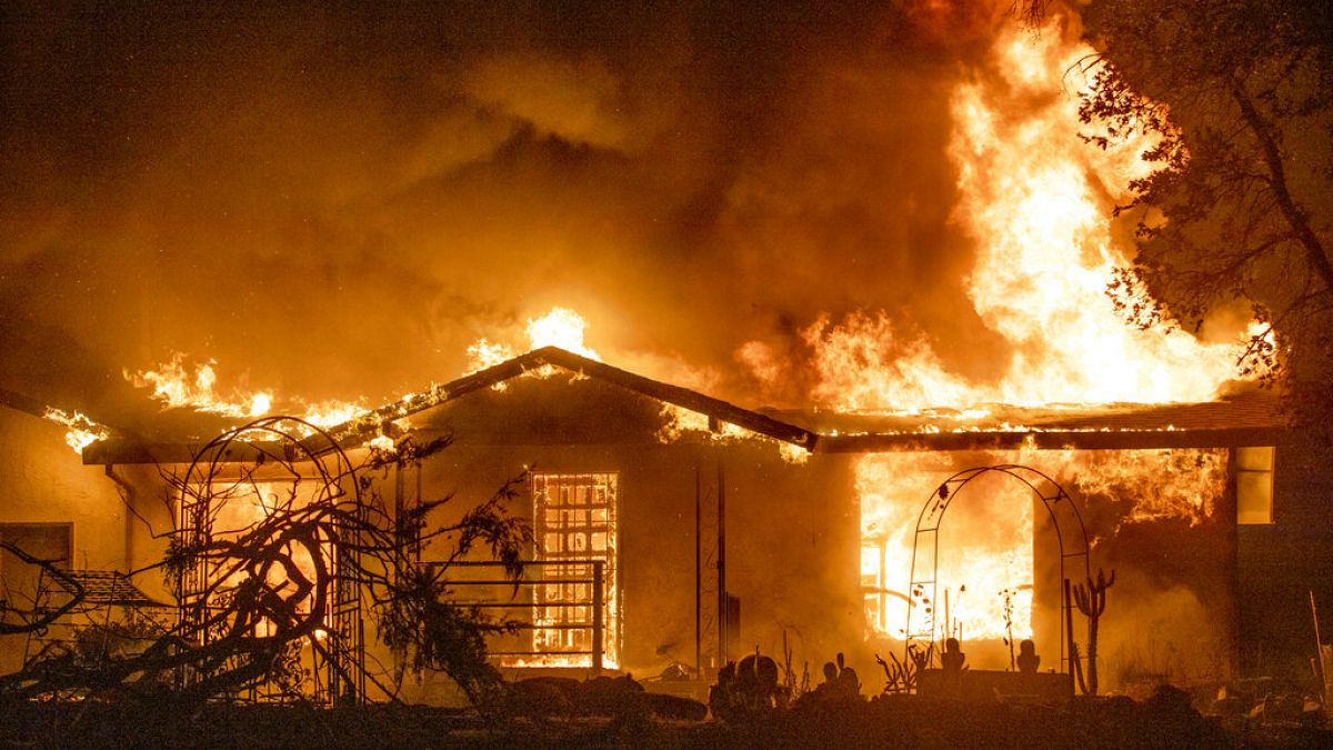 Sept. 27, 2020, a house burns at the Zogg Fire near Ono, Calif. California 