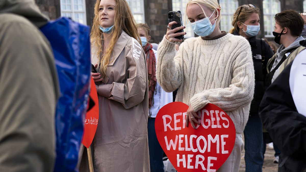 People attend a demonstration against the tightening of Denmark's migration policy and the deportation orders in Copenhagen, Denmark, April 21, 2021. 