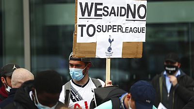Tottenham fans stage a protest against the Board over the planned creation of a European Super League, outside the Tottenham Hotspur Stadium, Wednesday April 21, 2021. 