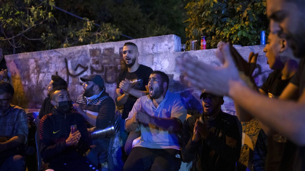 Palestinians singing during a protest in east Jerusalem on Friday