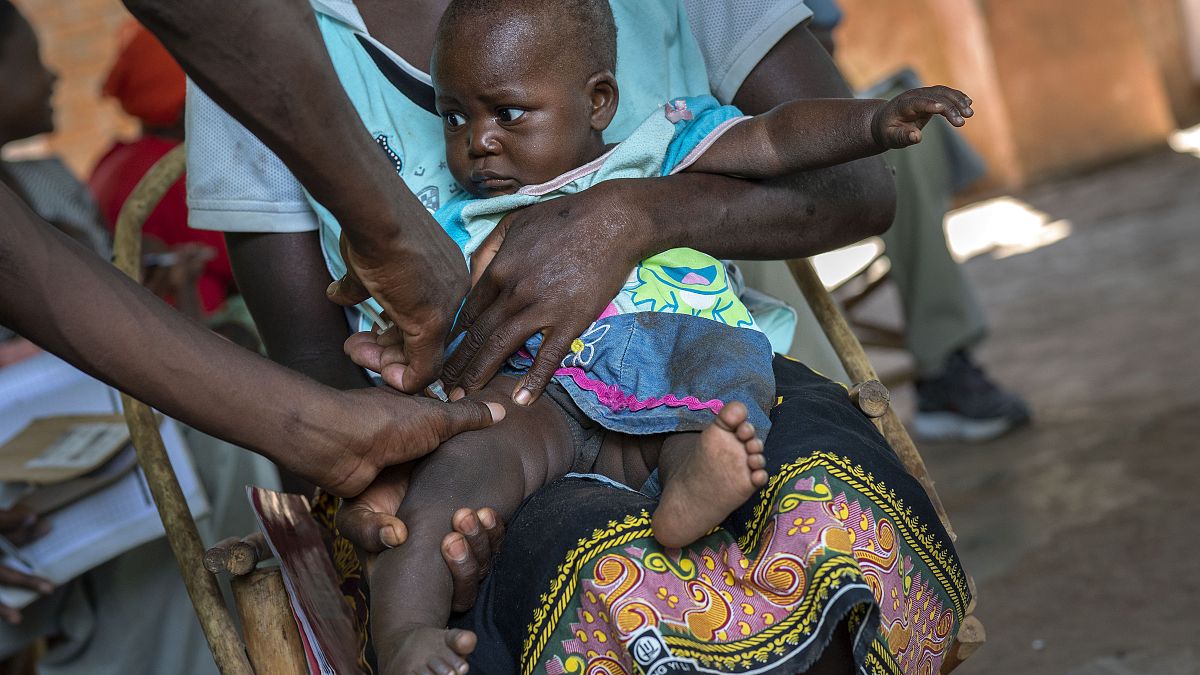 In this Dec. 11, 2019 file photo, a baby from the Malawi village of Tomali is injected with the world's first vaccine against malaria in a pilot programme.