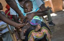 In this Dec. 11, 2019 file photo, a baby from the Malawi village of Tomali is injected with the world's first vaccine against malaria in a pilot programme.