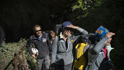 Members of the French team that participated in the "Deep Time" study, emerge from the Lombrives Cave after 40 days underground in Ussat les Bains, France, Saturday, April 24.