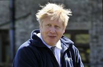 Britain's Prime Minister Boris Johnson during a visit at Moor Farm in Stoney Middleton, England, Friday, April 23, 2021, as part of a Conservative party local election visit.