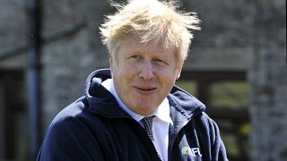 Britain's Prime Minister Boris Johnson during a visit at Moor Farm in Stoney Middleton, England, Friday, April 23, 2021, as part of a Conservative party local election visit. 