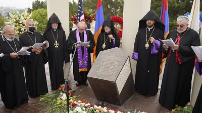 Religious leaders sing at a ceremony at the Montebello Armenian Genocide Monument in Montebello, Calif., Saturday, April 24, 2