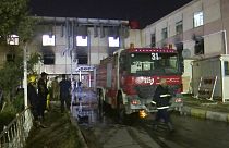 First responders work the scene of a hospital fire in Baghdad on Saturday, April 24, 2021