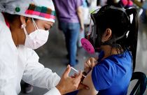 A COVID vaccine is administered in Honduras