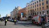 The Latvian State Fire and Rescue Service works at the site of a fire, in Riga, Latvia, Wednesday, April 28, 2021.