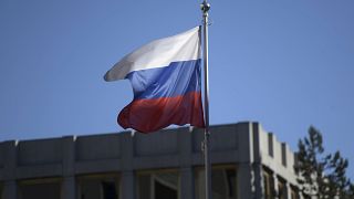 The Russian flag flies over the Russian Embassy in Helsinki