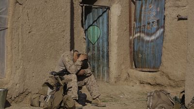A U.S. Marine from 3rd Battalion, 6th Marine Regiment sits alone after a patrol