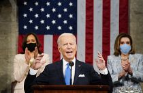 Vice President Kamala Harris, and House Speaker Nancy Pelosi of Calif., stand and applaud as President Joe Biden addresses a joint session of Congress. April 28, 2021.