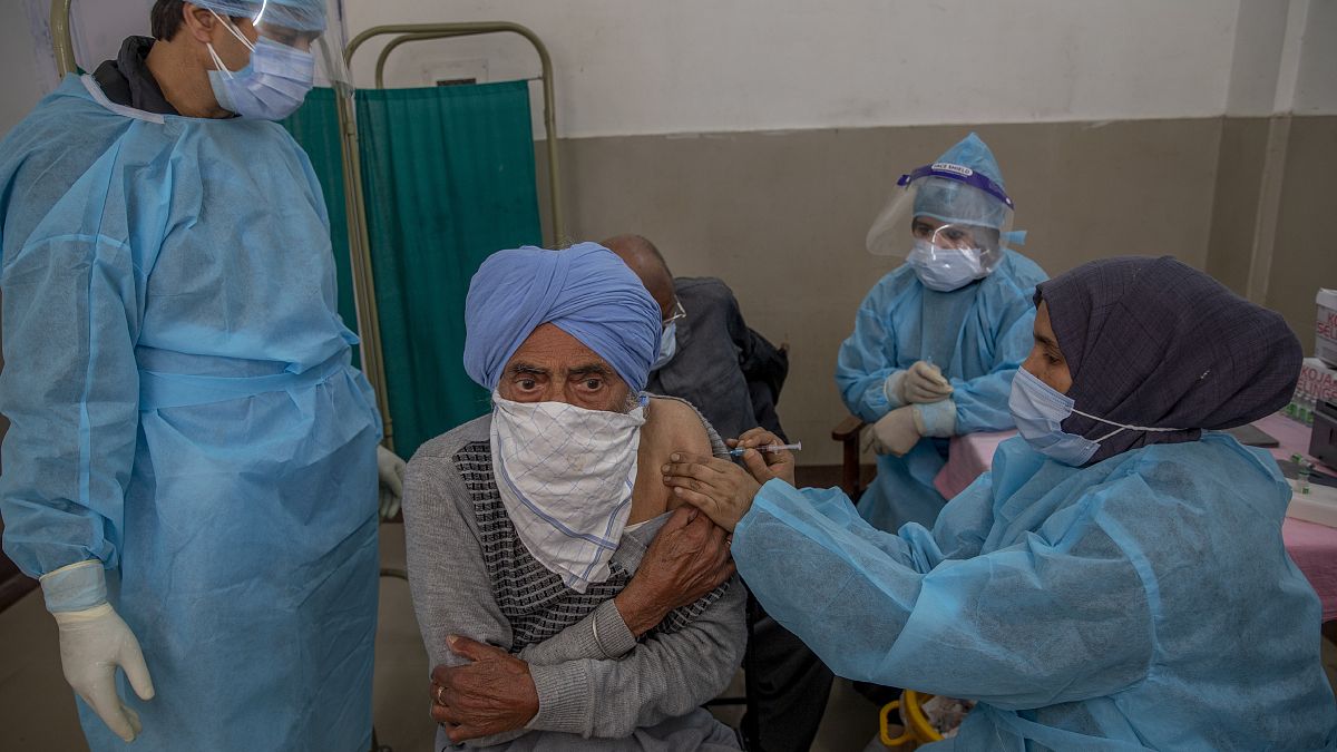 A man receives the COVISHIELD vaccine for COVID-19 at a primary health center in Srinagar, Indian controlled Kashmir, Wednesday, April 28, 2021.